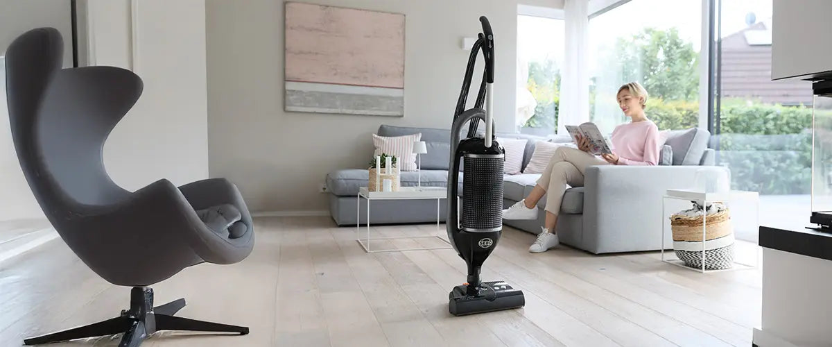 SEBO Felix upright vacuum in a bright living room